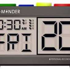 A clock with digital display and four differently colored buttons on top